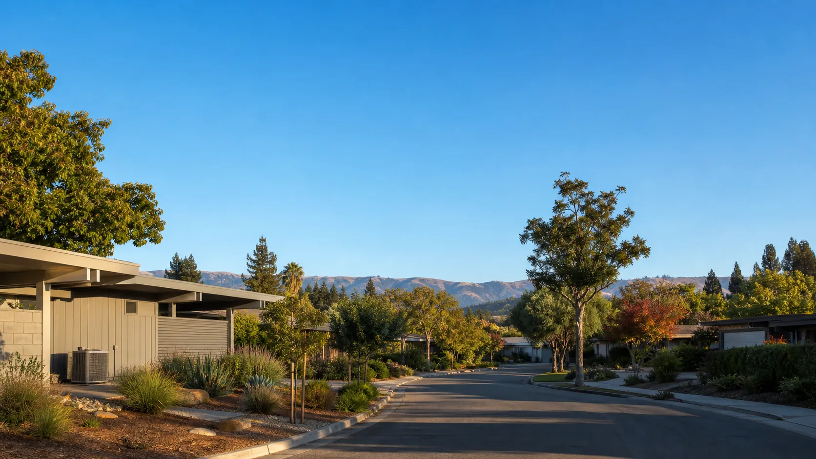 Quiet Sunnyvale residential street of mid-century homes with the Bay Area hills on the horizon